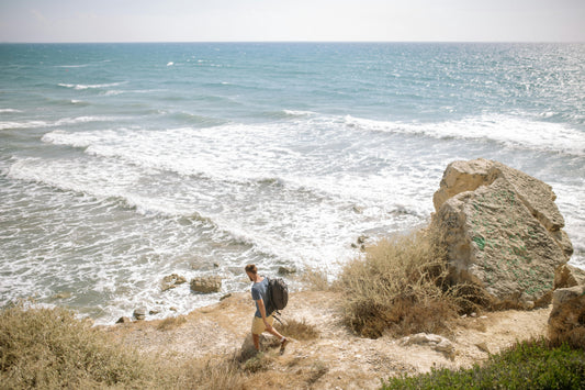 Man hiking along beach